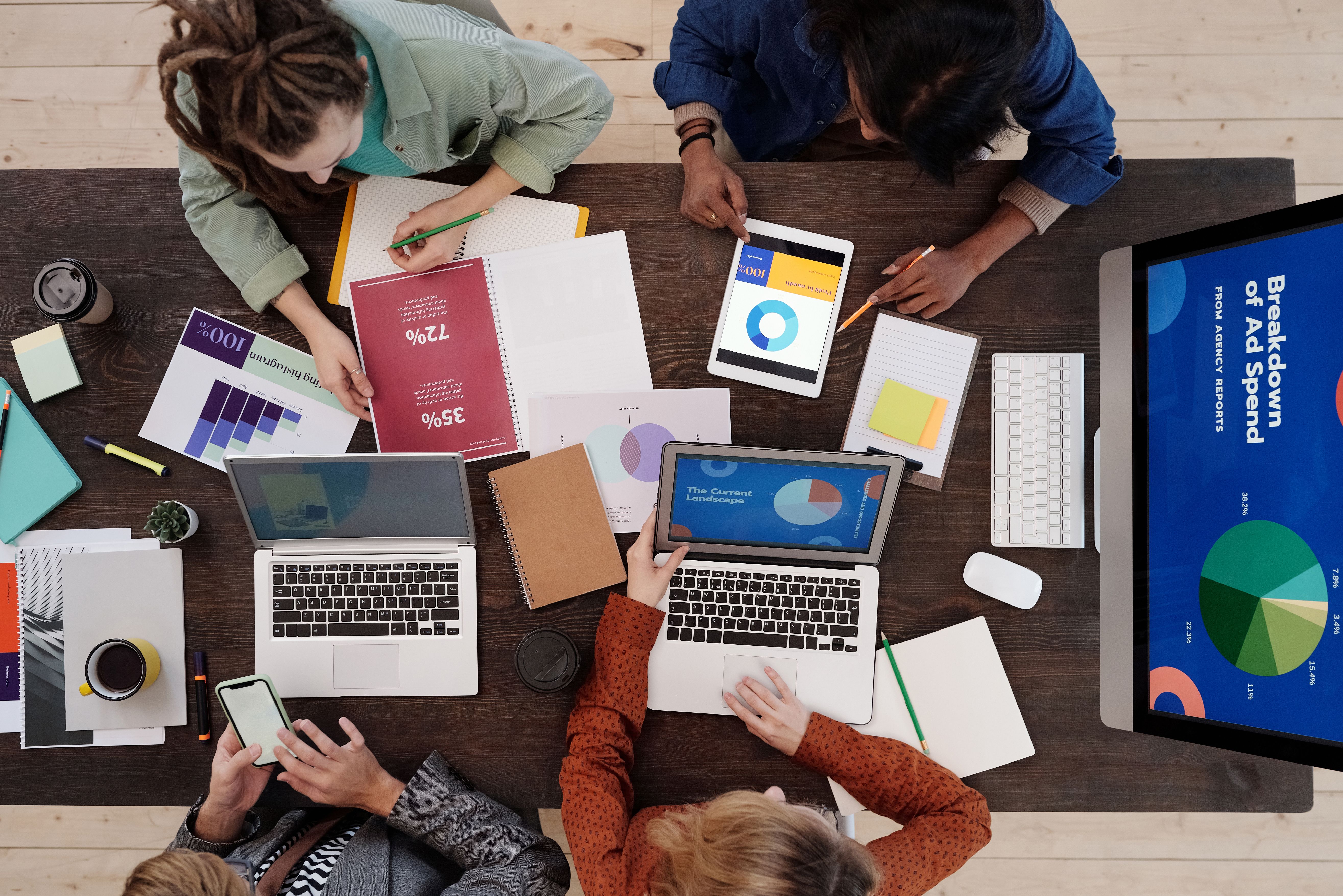 Marketing team reviewing reports — local SEO for roofers, plumbers and contractors