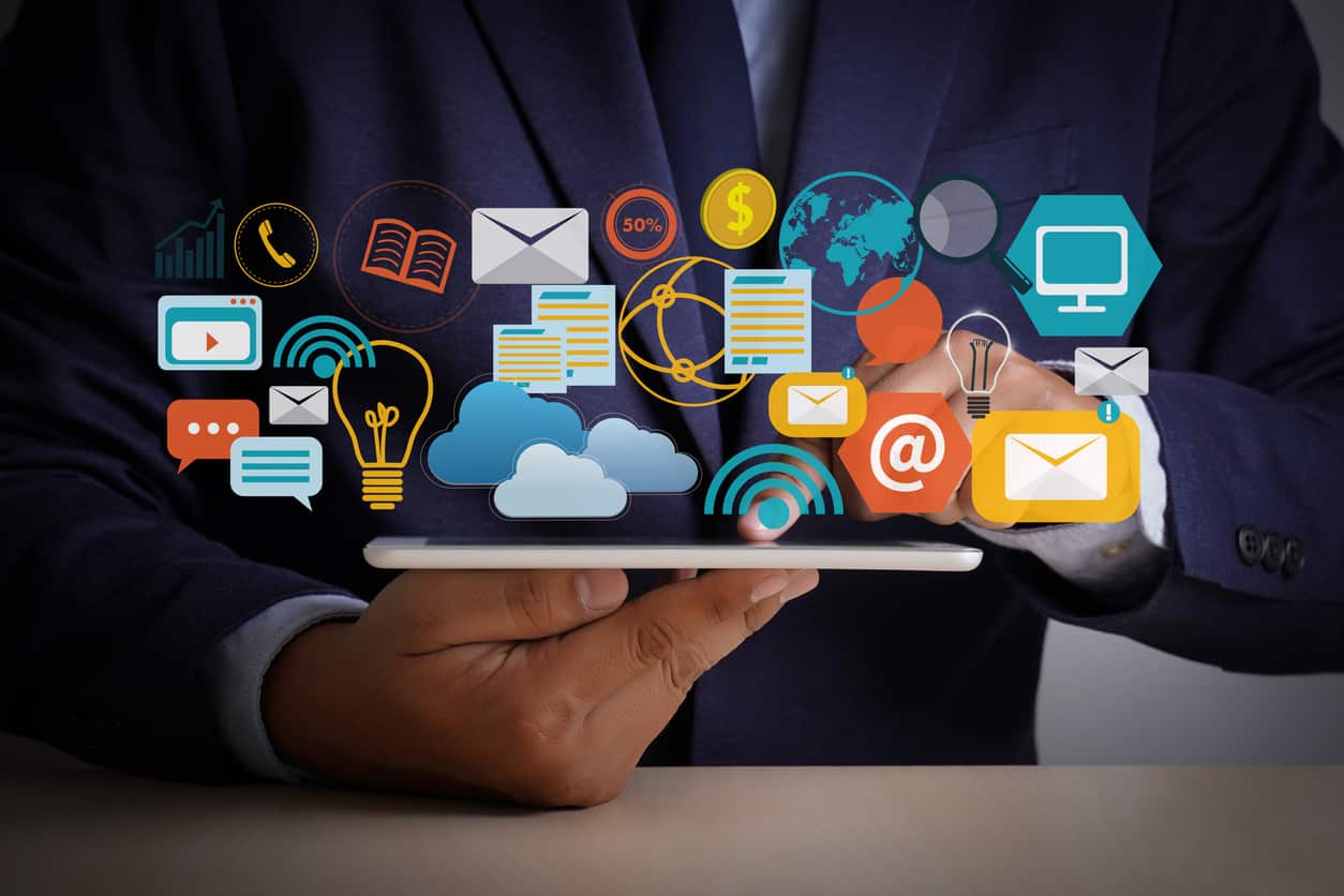 Businessman holding a tablet with marketing icons — why reviews drive local SEO and AI recommendations